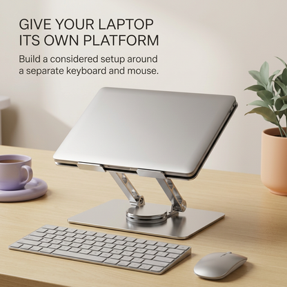 Laptop stand arranged with a separate keyboard and mouse